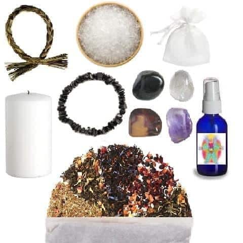 Negative Energy Kit, collection of crystals, herbs, and spiritual tools for cleansing and protection.