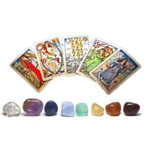 Crystal Tarot Set, a collection of tarot cards with detailed illustrations and colorful gemstone crystals arranged in front of the cards.