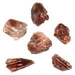 Dragon’s Blood Calcite Rough, a collection of raw, reddish-brown mineral stones with a rough texture.