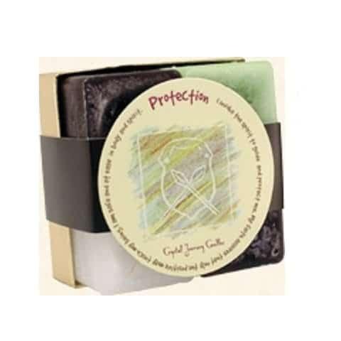 Protection Candle Set, includes a round candle with protective symbols and a booklet, in a black sleeve with protective text.