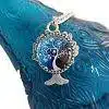 Tree of Life Pendant, silver charm featuring a detailed tree design with roots and branches
